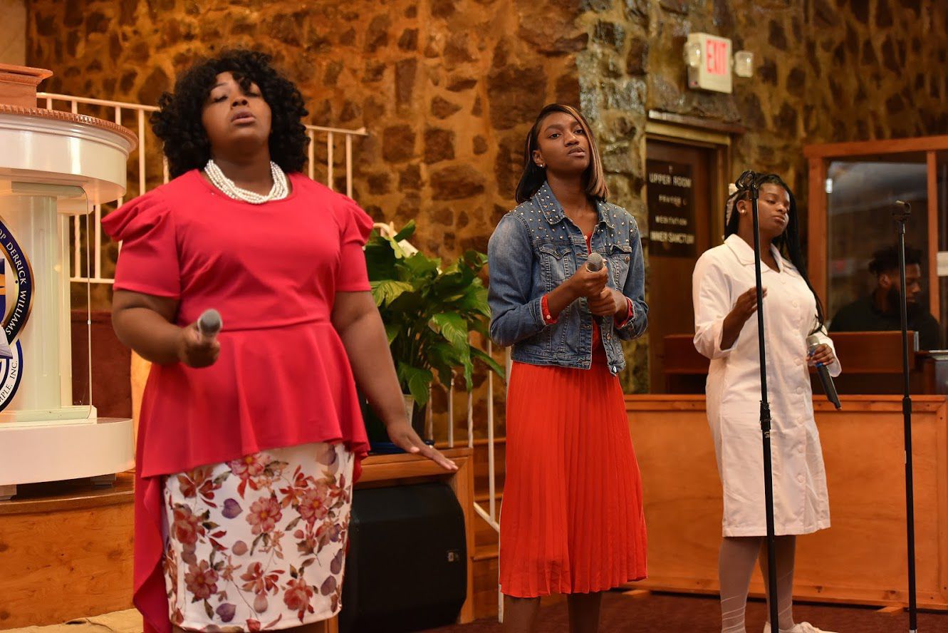 The Praise and Worship Team sings a selection.